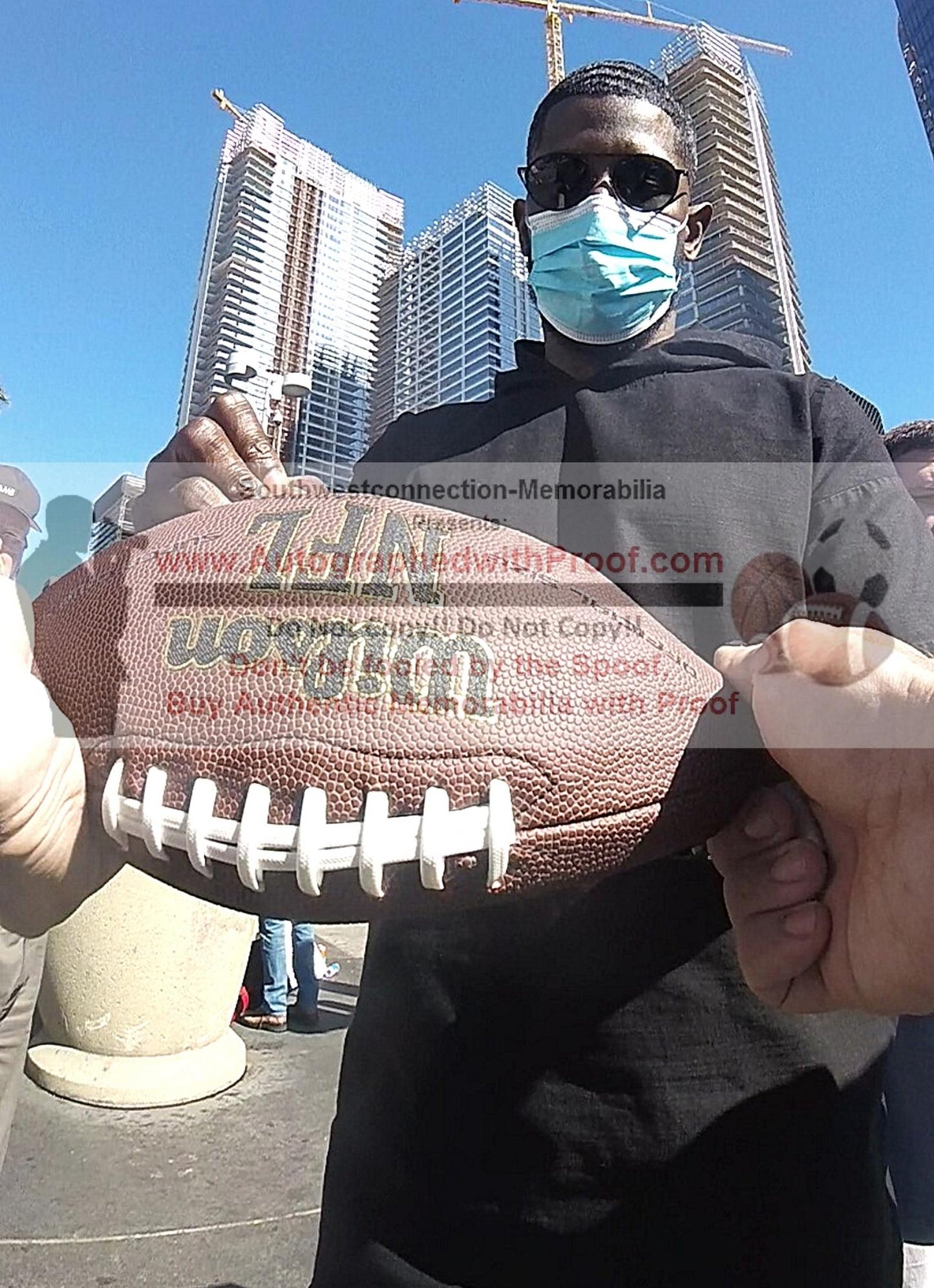 Footballs- Autographed- Marcus Trufant Signing NFL Wilson Super Grip Football Seattle Seahawks Beckett BAS Authentication 1