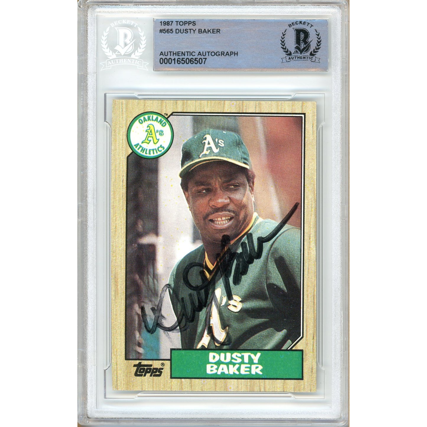 Baseball trading card of Dusty Baker with a green cap and Oakland Athletics logo, encased in a protective frame.