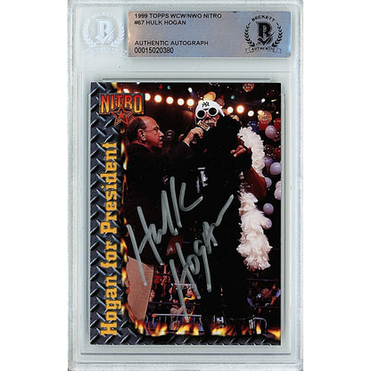 Wrestling- Autographed- Hollywood Hulk Hogan Signed 1999 Topps WCW NWO Nitro Trading Card Beckett Authentic Auto Slab Front