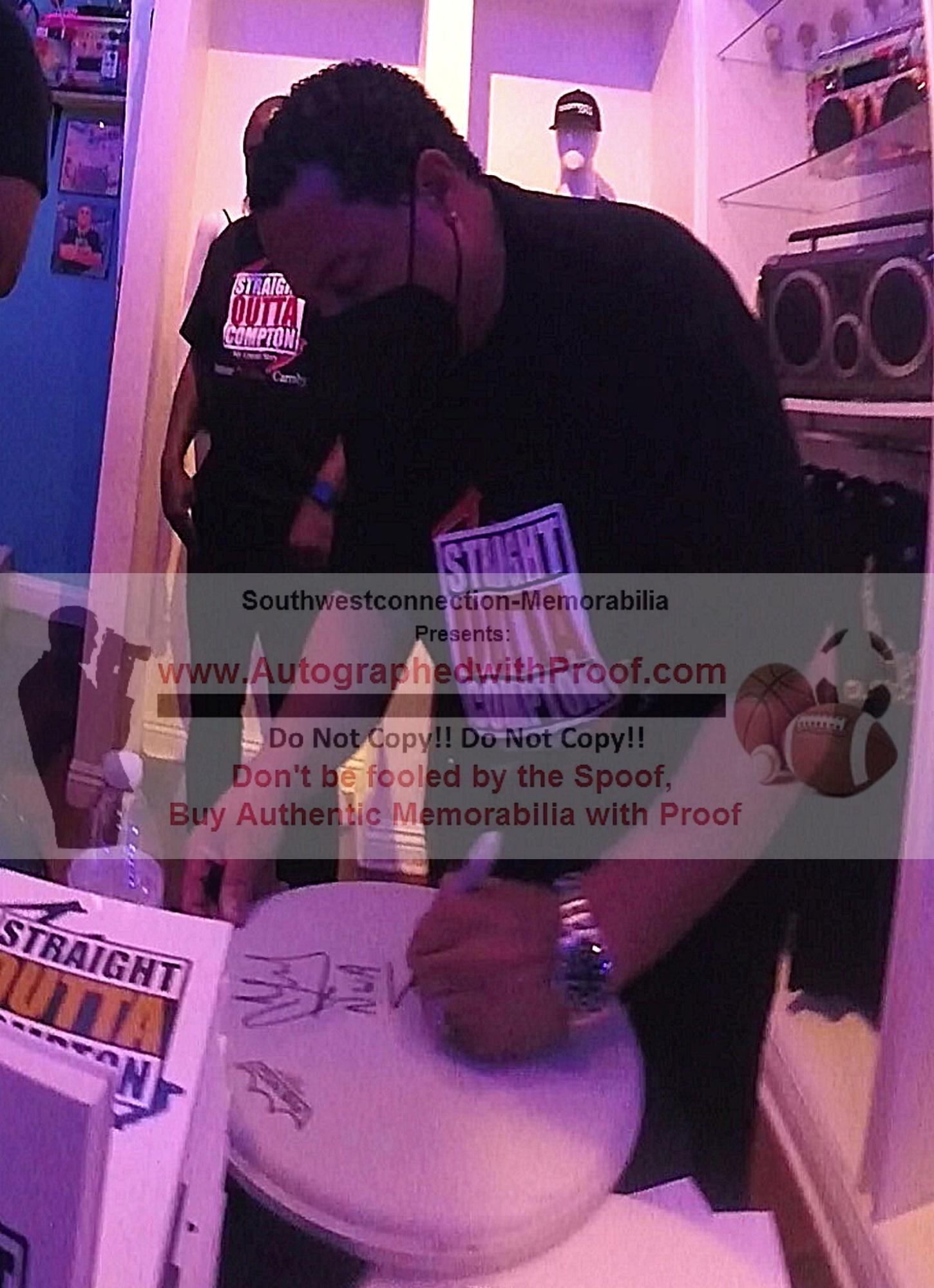 Music- Autographed- DJ Yella Signing Remo Drumhead with NWA Inscription Beckett Authentic Auto COA Front