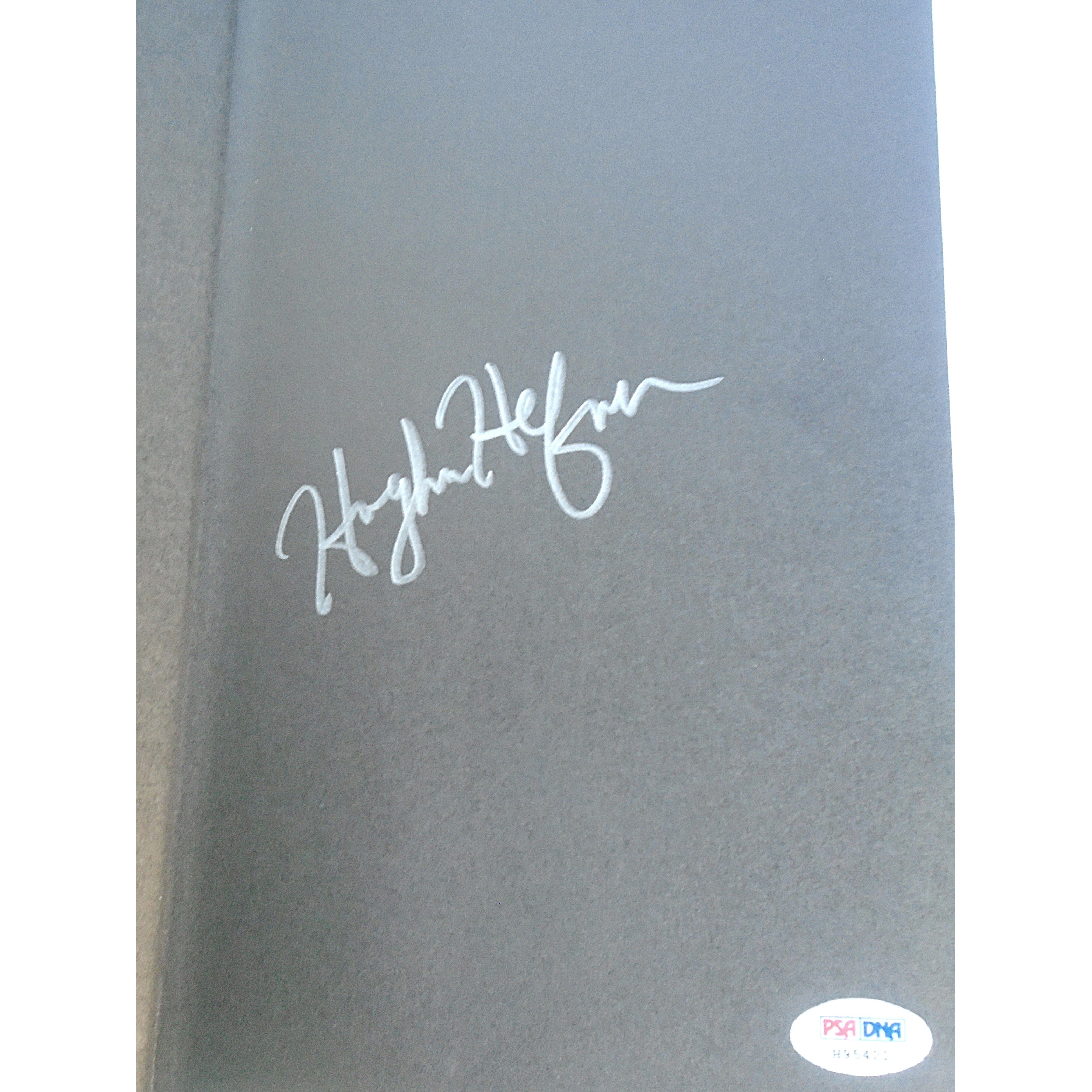 Hugh Hefner photo autograph – angled display – PSA/DNA COA