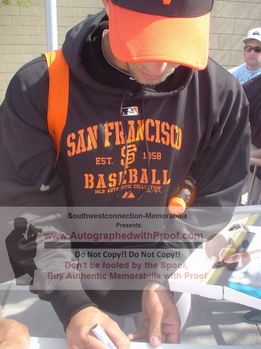 Home Plates- Autographed- Madison Bumgarner Signing San Francisco Giants Photo 2014 World Series Logo Schutt Pitching Rubber - Proof Photo - JSA Authentication - 1